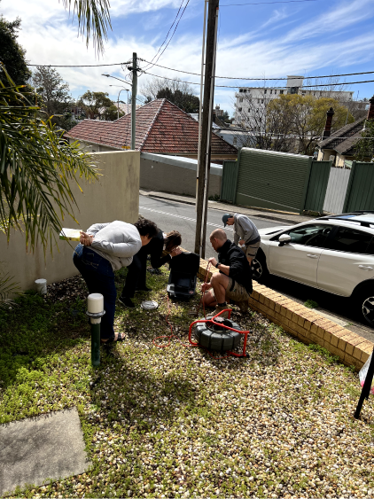 Members of the Mint Plumbing team clearing a drain