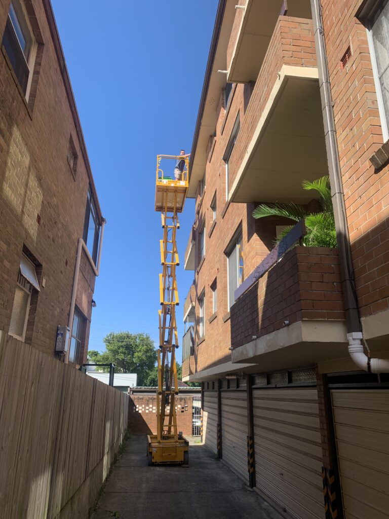 One of our local plumbers using a cherry picker