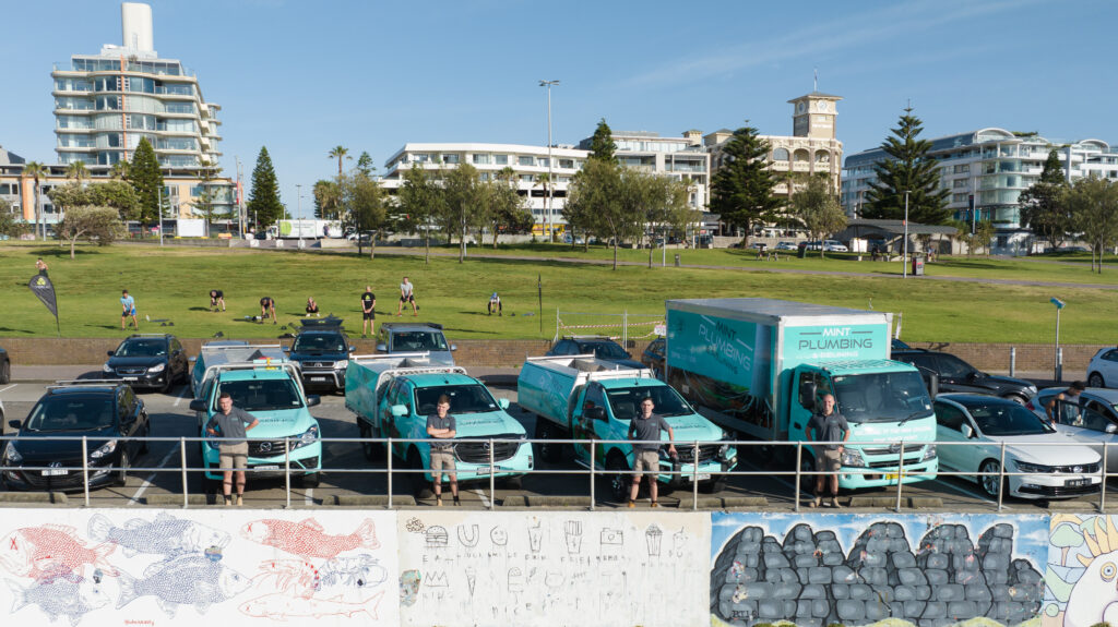 Our fleet of Mint Plumbing and Relining work trucks