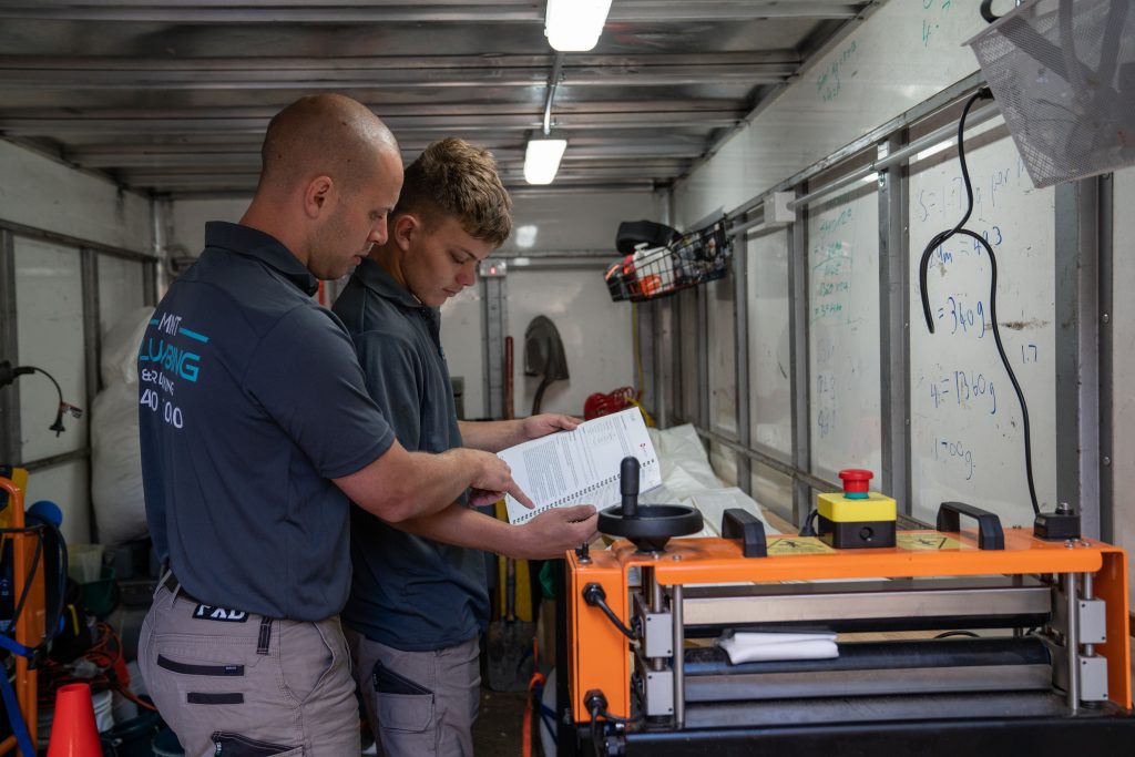 Two members of the Mint Plumbing and Relining team