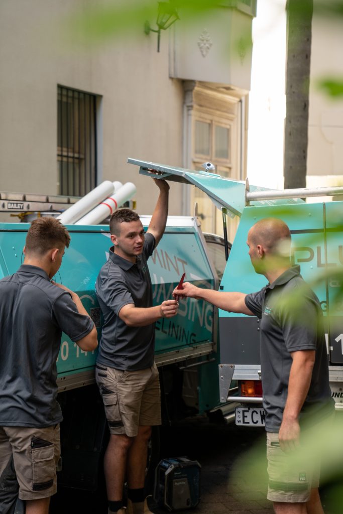 Team of professional emergency plumbers from Mint Plumbing & Relining preparing for a 24/7 plumbing service call in Sydney’s Eastern Suburbs, showcasing fast and reliable plumbing expertise.