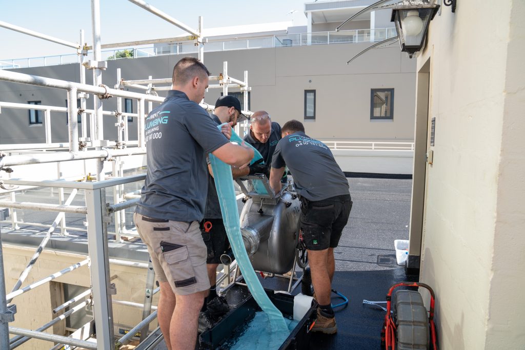 Members of the Mint Plumbing Team completing a Relining job