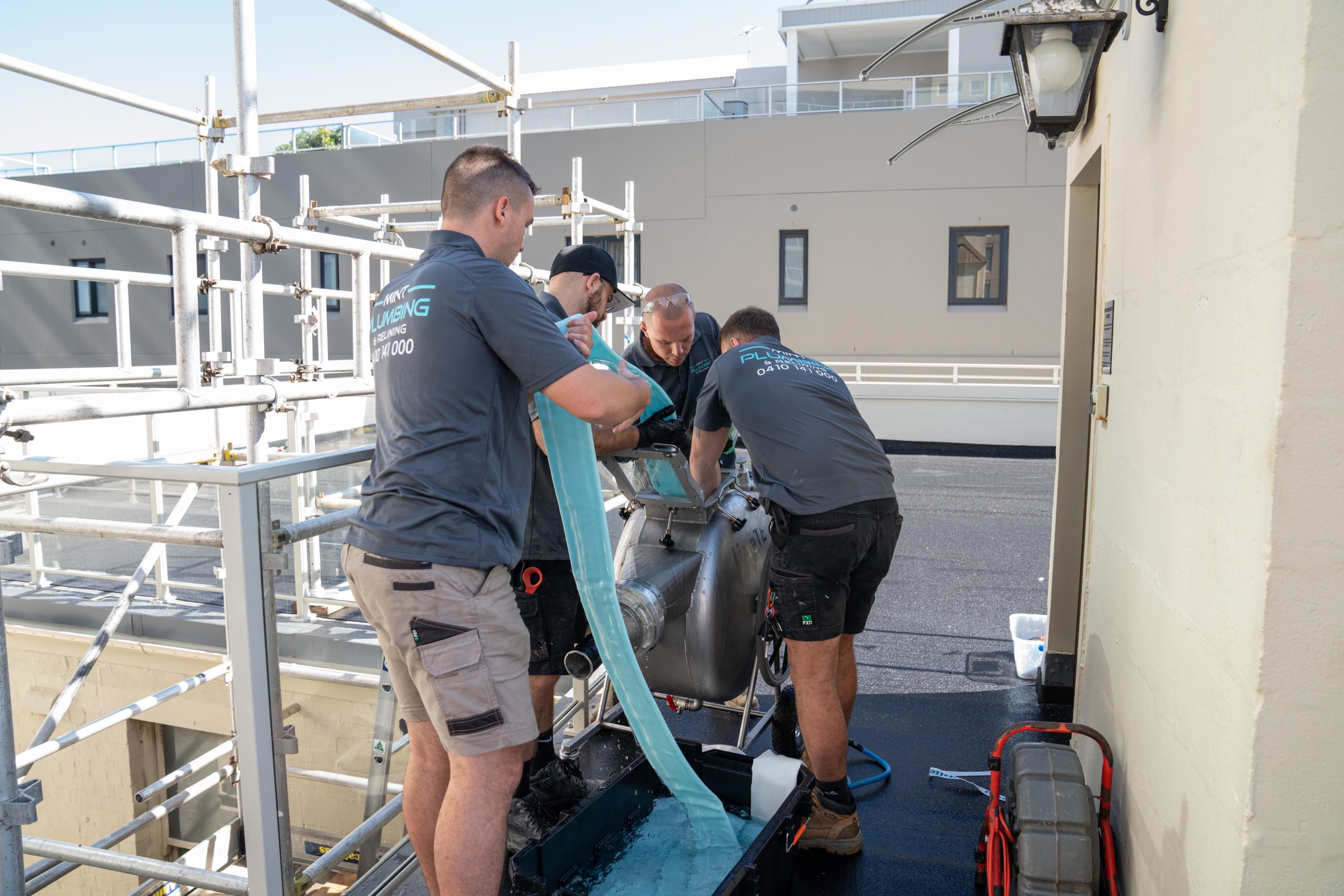 Members of the Mint Plumbing Team completing a Relining job