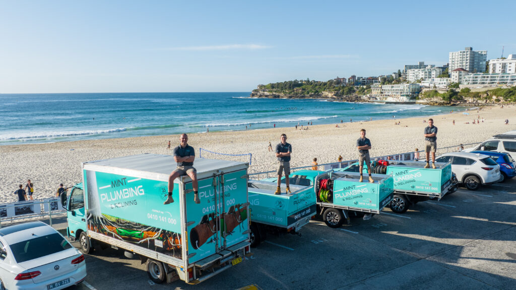 Our fleet of Mint Plumbing and Relining work trucks