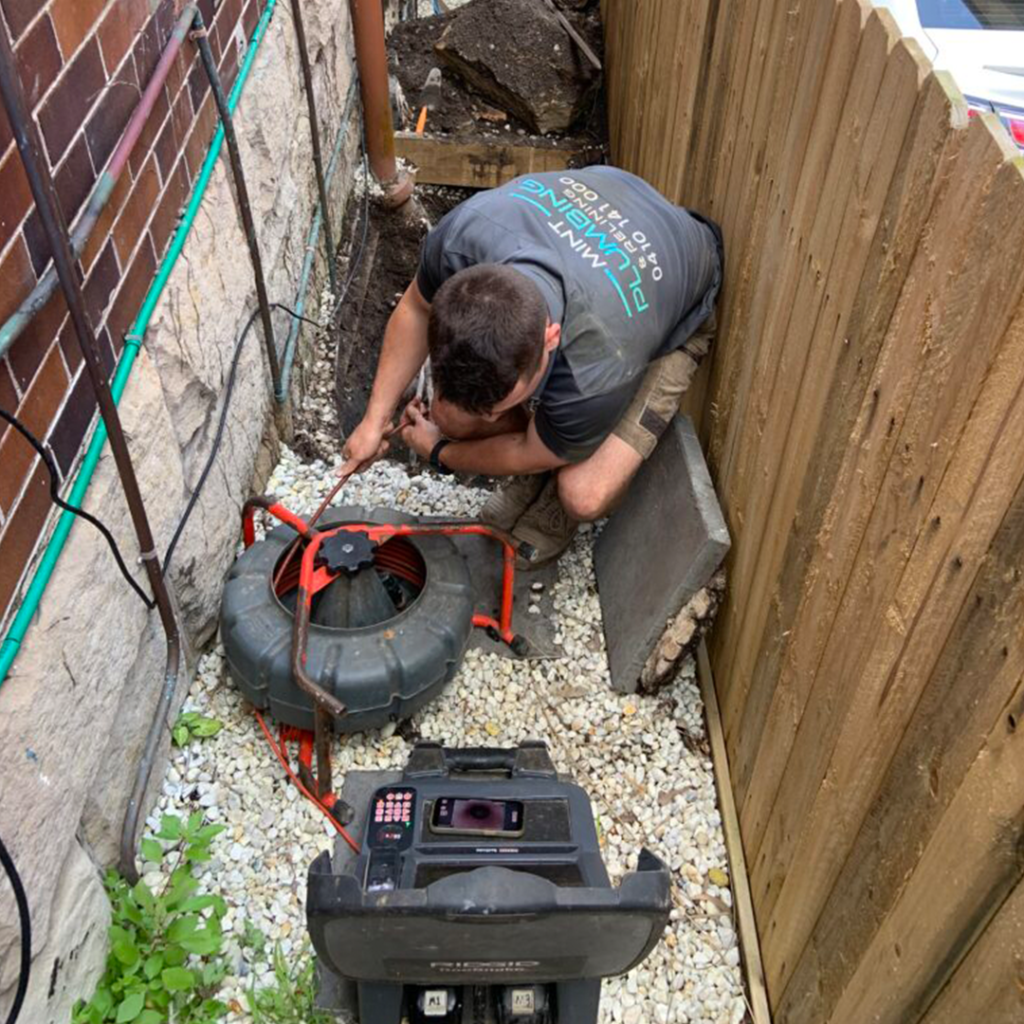 Our bondi plumbers clearing a blocked drain